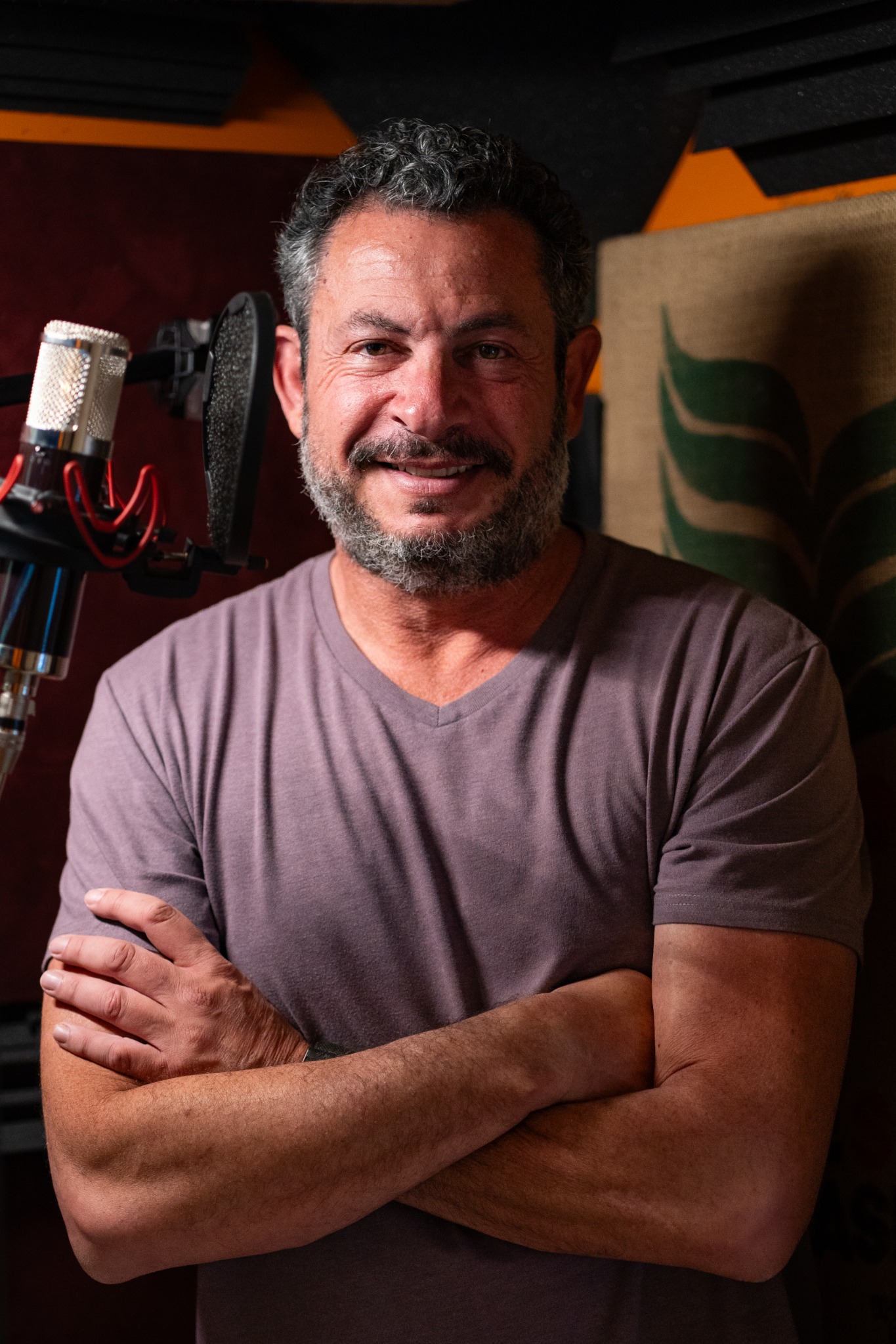 Diego Diment beside a microphone in his recording studio
